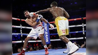 Terence Crawford retains WBO welterweight title after accidental low blow renders Amir Khan unable to continue