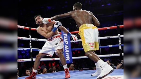 Terence Crawford retains WBO welterweight title after accidental low blow renders Amir Khan unable to continue