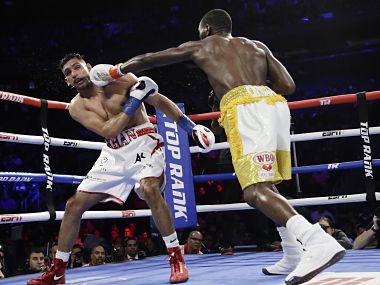 Terence Crawford retains WBO welterweight title after accidental low blow renders Amir Khan unable to continue Terence Crawford retains WBO welterweight title after accidental low blow renders Amir Khan unable to continue