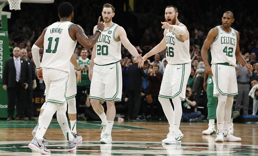 Kyrie Irving (left) and his Boston Celtics teammates react after an Irving basket against the Indiana Pacers. USA TODAY Sports/Reuters