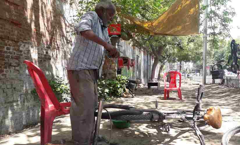 Rajjan, a former employee of the Elgin Mill which was decalred sick in 1991-92, now fixes bicycles outside the mill. Parth MN