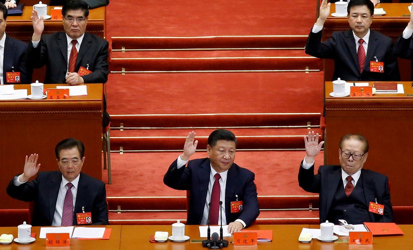 Xi Jinping has abandoned the cautious approach of his predecessors. Here he is seen flanked by former presidents Hu Jintao (left) and Jiang Zemin (right) at the 19th Communist Party Congress in Beijing in October 2017. Reuters