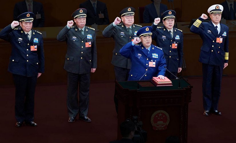 In background, from left to right are Zhang Shengmin, Li Zuocheng, Zhang Youxia, Wei Fenghe, Miao Hua. In foreground, the speaker is Xu Qiliang. Reuters