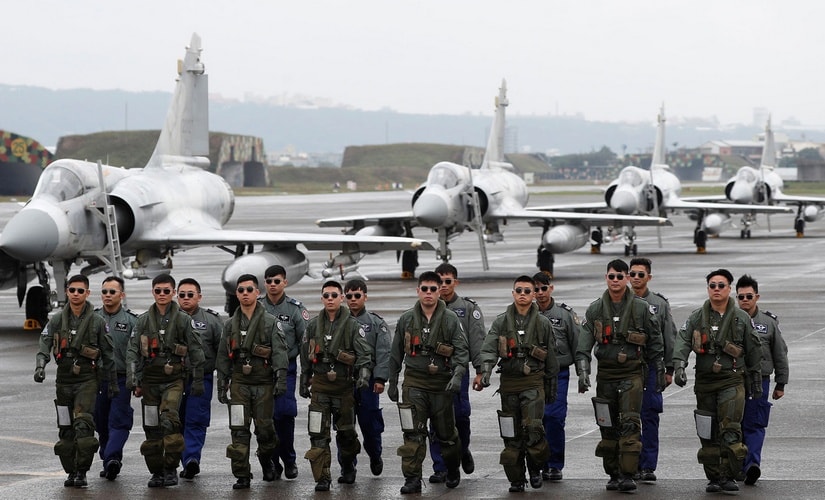 Taiwanese Mirage fighter pilots walk on a runway at a base in the city of Hsinchu in January this year during military readiness drills ahead of Chinese New Year. As China’s military power grows, the United States is expanding strategic ties with regional allies like Taiwan. Reuters