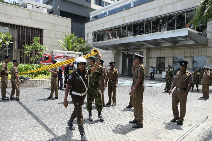 Security personnel cordon the entrance to Shangri-La Hotel. A Gamage/101Reporters