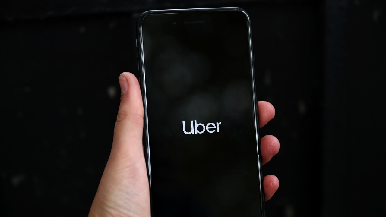 Uber's logo is displayed on a mobile phone. Image: Reuters.