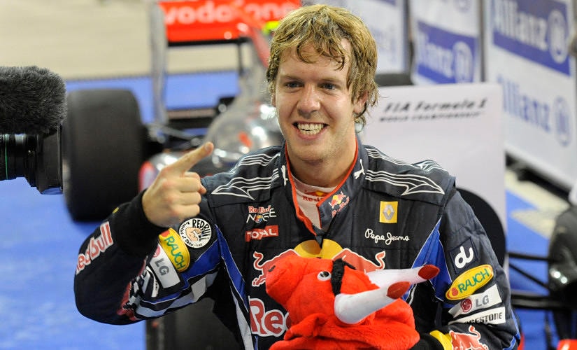 Sebastian Vettel of Red Bull Racing celebrates winning the Abu Dhabi GP and 2010 World Championship title. Reuters