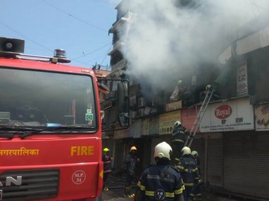 Fire at Crawford Market in Mumbai: Firefighters trying to douse flames at building in Kalher area; no casualties reported Fire at Crawford Market in Mumbai: Firefighters trying to douse flames at building in Kalher area; no casualties reported