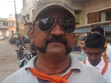 Fact Check: No, Wg Cdr Abhinandan Varthaman is not wearing scarf with BJP symbol; lookalike's photo makes news Fact Check: No, Wg Cdr Abhinandan Varthaman is not wearing scarf with BJP symbol; lookalike's photo makes news