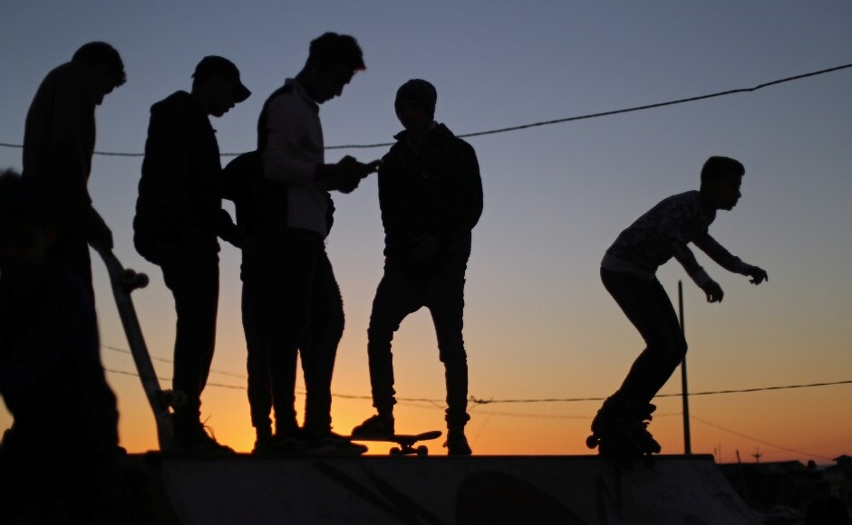 At one of Gaza's beachfront skating parks, the Team skateboard and rollerblade, zipping around curves and jumping over concrete obstacles, delighting onlookers. Reuters/Mohammed Salem. At one of Gaza's beachfront skating parks, the Team skateboard and rollerblade, zipping around curves and jumping over concrete obstacles, delighting onlookers. Reuters/Mohammed Salem.