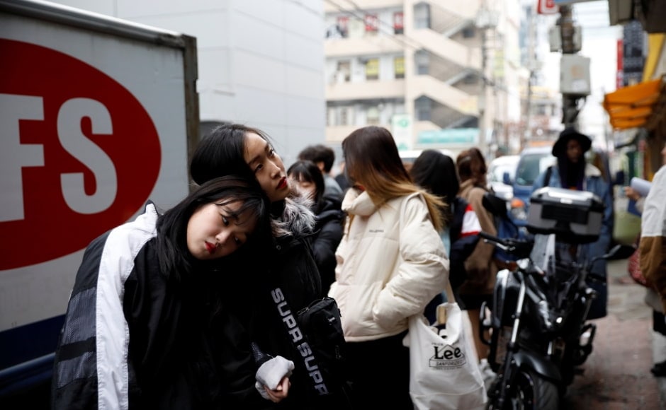 Two applicants who want to become K-pop stars, spend time before taking part in an audition in Seoul. Reuters/Kim Hong-Ji. Two applicants who want to become K-pop stars, spend time before taking part in an audition in Seoul. Reuters/Kim Hong-Ji.