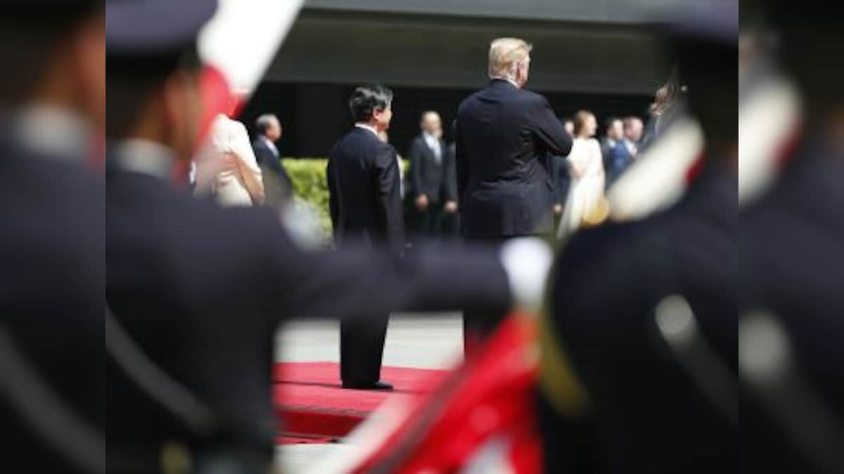 Donald Trump becomes first foreign leader to meet Japan's new Emperor Naruhito: Shinzo Abe hopes 'honour' will charm US president ahead of thorny trade talks