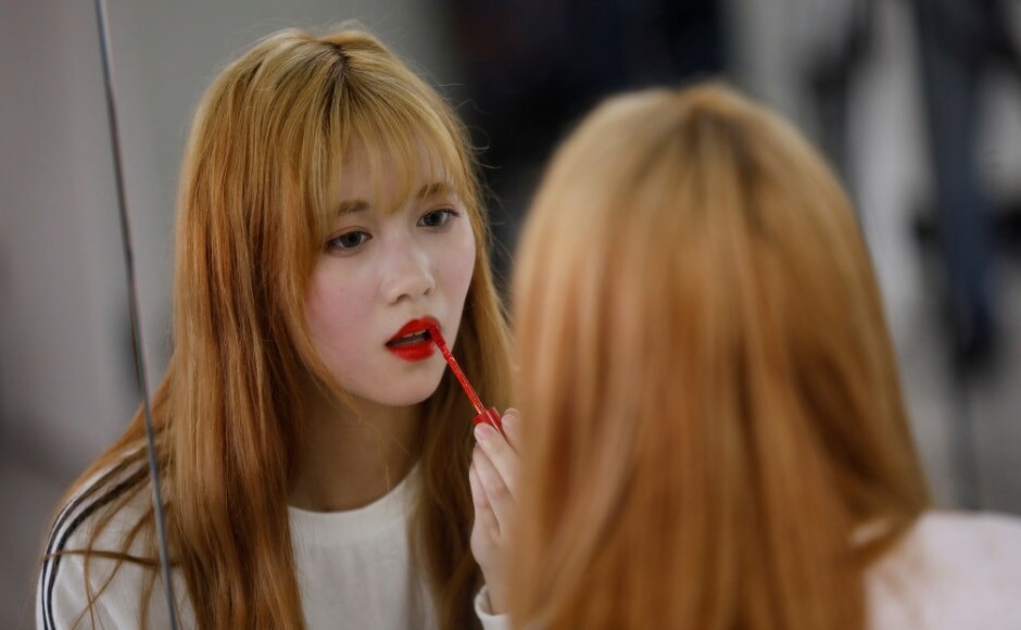 Yuho Wakamatsu, 15, who wants to become a K-pop star, adjusts her makeup during a training session in Seoul. Reuters/Kim Hong-Ji. Yuho Wakamatsu, 15, who wants to become a K-pop star, adjusts her makeup during a training session in Seoul. Reuters/Kim Hong-Ji.