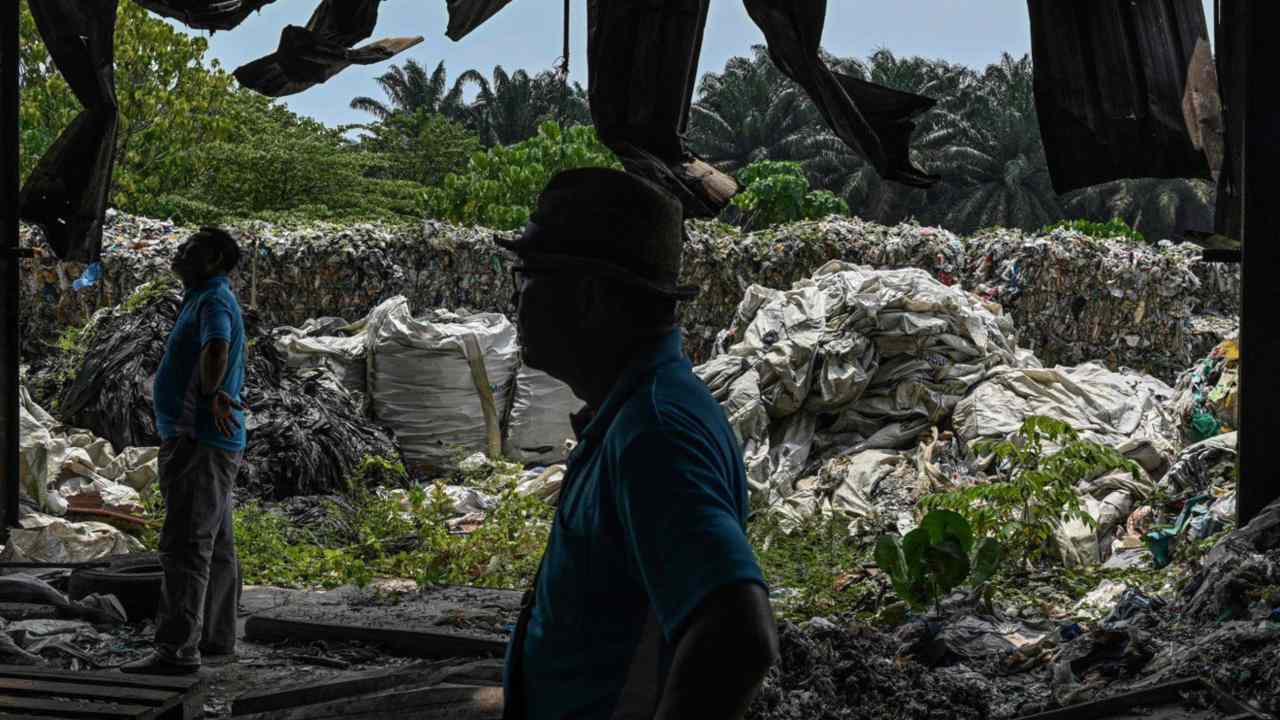 An environmental NGO in Kuala Lampur, Malaysia, inspect an abandoned plastic waste factory. Image: AFP