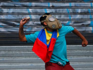 Venezuela protests: 27-year-old woman dies in rioting; 24 injured in May Day clashes between Juan Guaido supporters and military forces Venezuela protests: 27-year-old woman dies in rioting; 24 injured in May Day clashes between Juan Guaido supporters and military forces