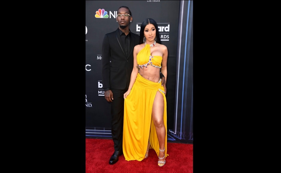 Cardi B walked the Billbaord Music Awards red carpet with husband Offset in a yellow two-piece oufit. Source: Twitter.