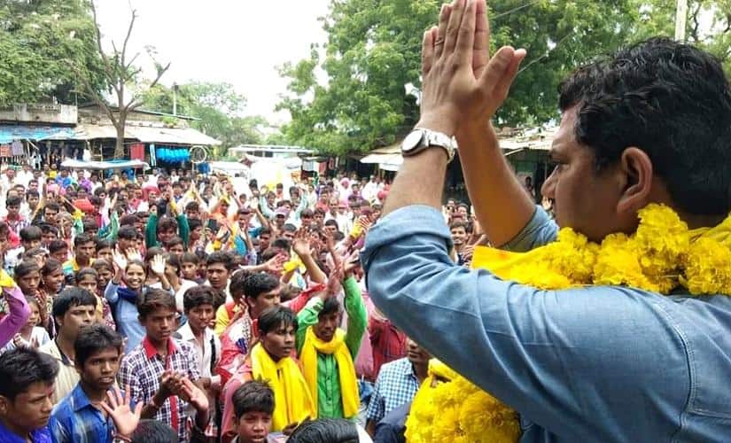 Dr Hiralal Alawa , MLA from Manavar waves at a crowd. Firstpost/Bishan Singh
