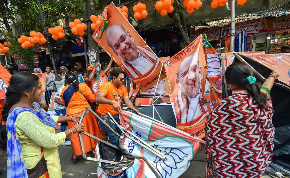 The roadshow turned violent with posters, hoardings and banners of Shah and Narendra Modi being vandalised. PTI The roadshow turned violent with posters, hoardings and banners of Shah and Narendra Modi being vandalised. PTI