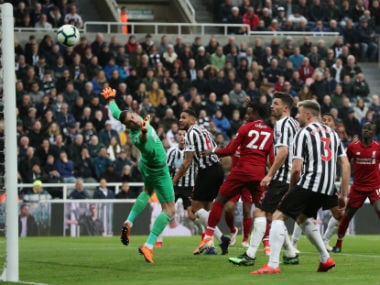 Premier League: Divock Origi heads late winner against Newcastle United as Liverpool go top; Cardiff City suffer relegation