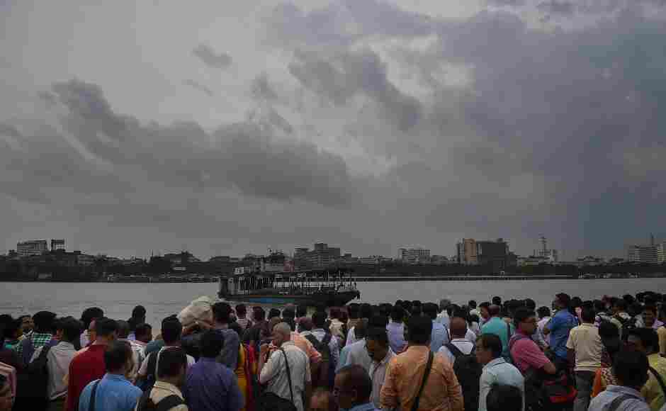 Office goers could be seen waiting for a ferry to travel across a river during rainfall in Kolkata on Friday. As Cyclone Fani moved closer, the West Bengal government sounded an alert in coastal East Midnapore and South 24 Parganas districts, asking tourists to leave seaside destinations and directing fishermen not to venture into the sea. PTI Office goers could be seen waiting for a ferry to travel across a river during rainfall in Kolkata on Friday. As Cyclone Fani moved closer, the West Bengal government sounded an alert in coastal East Midnapore and South 24 Parganas districts, asking tourists to leave seaside destinations and directing fishermen not to venture into the sea. PTI