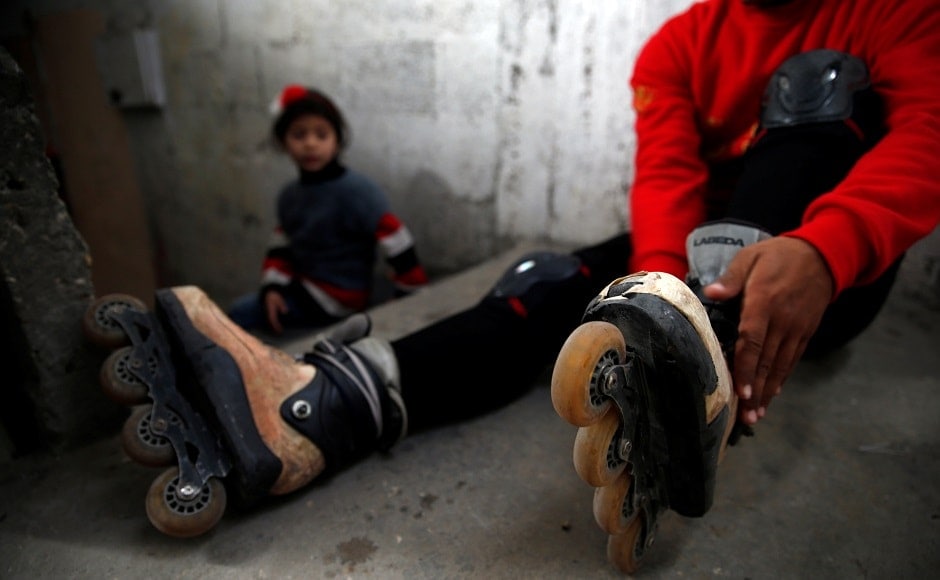 Sarhan puts on his rollerblades in his family house in Gaza City. Reuters/Mohammed Salem Sarhan puts on his rollerblades in his family house in Gaza City. Reuters/Mohammed Salem