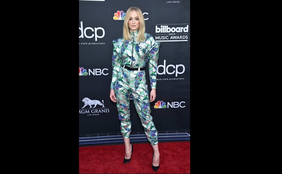 Sophie Turner in a multicolored and multidimensional jumpsuit by Louis Vuitton.