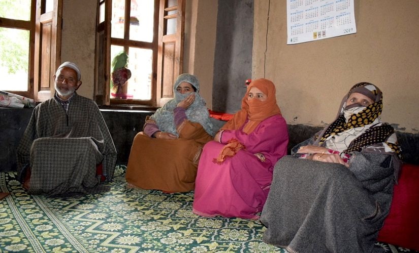 Family members of Sajad Ahmad Sheikh, who was arrested in a midnight raid. Firstpost/Qasim Mir