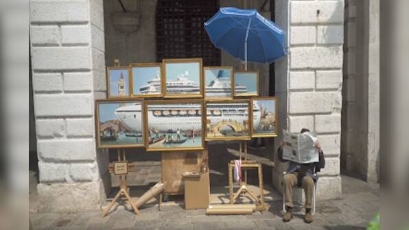 Banksy crashes the Venice Biennale with unauthorised street stall; posts video on social media