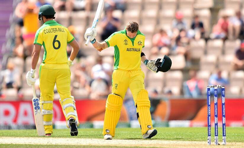Australia's Steve Smith (R) celebrates reaching his century during the 2019 Cricket World Cup warm up match between England and Australia at the Rose Bowl in Southampton, southern England, on May 25, 2019. (Photo by Glyn KIRK / AFP)