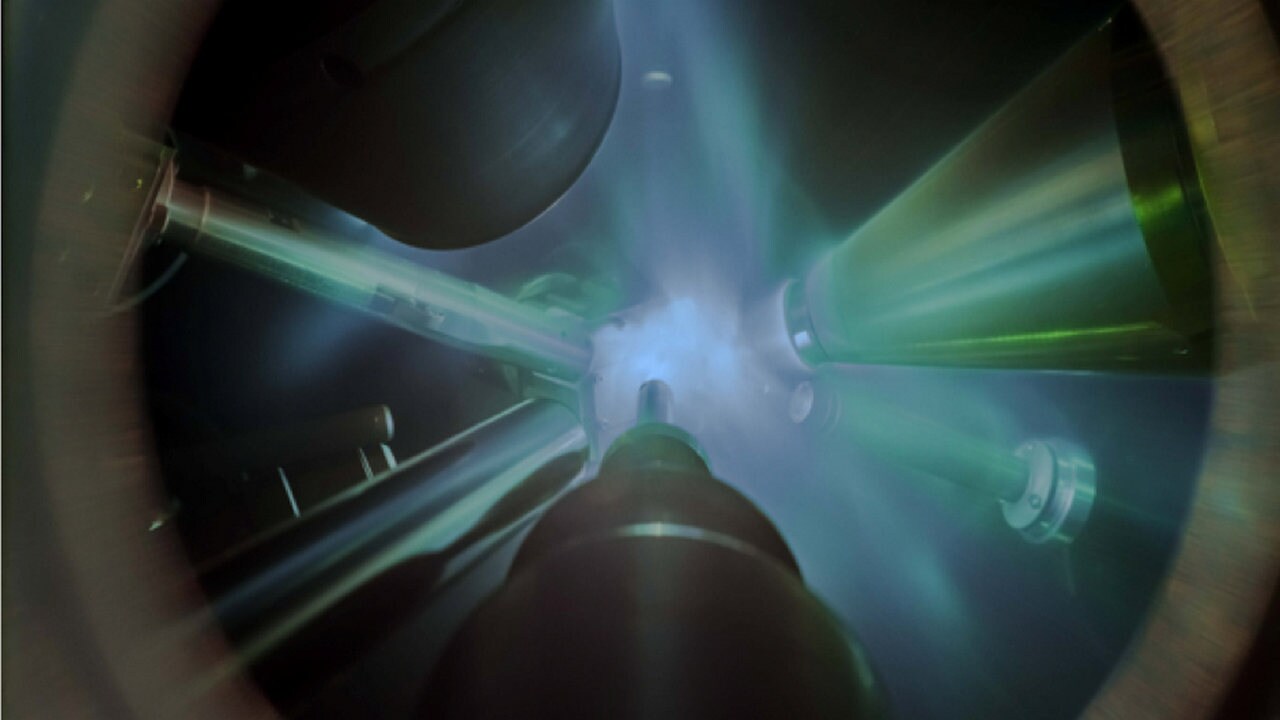 Giant lasers focused on the water sample, sitting on the front plate. Image credit: Lawrence Livermore National Laboratory