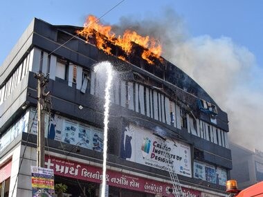 Surat fire: Tyres used as chairs, flexes aggravated blaze, distant location of fire tenders hampered operations, says official