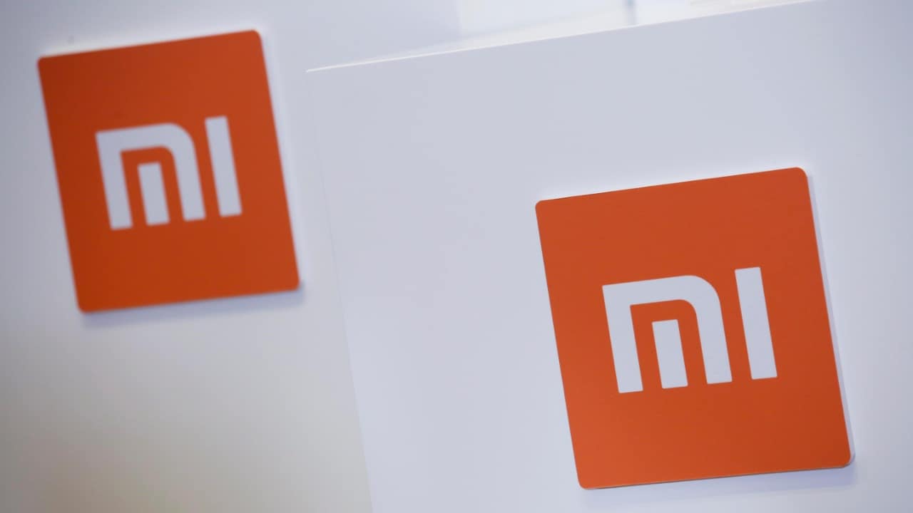 Xiaomi logos are seen during a news conference in Hong Kong, China. Image: Reuters.
