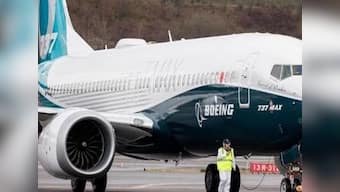 New software glitch in Max 737 is pushing aircraft's nose down; Boeing says working on fix to reduce 'pilot workload'