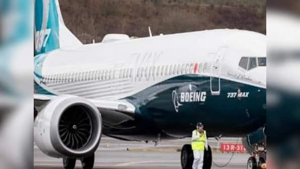 New software glitch in Max 737 is pushing aircraft's nose down; Boeing says working on fix to reduce 'pilot workload'