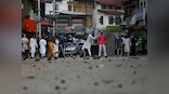 Protestors waving Zakir Musa banners clash with security forces after Eid prayers in some parts of Jammu and Kashmir