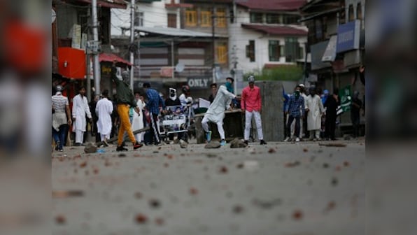Protestors waving Zakir Musa banners clash with security forces after Eid prayers in some parts of Jammu and Kashmir