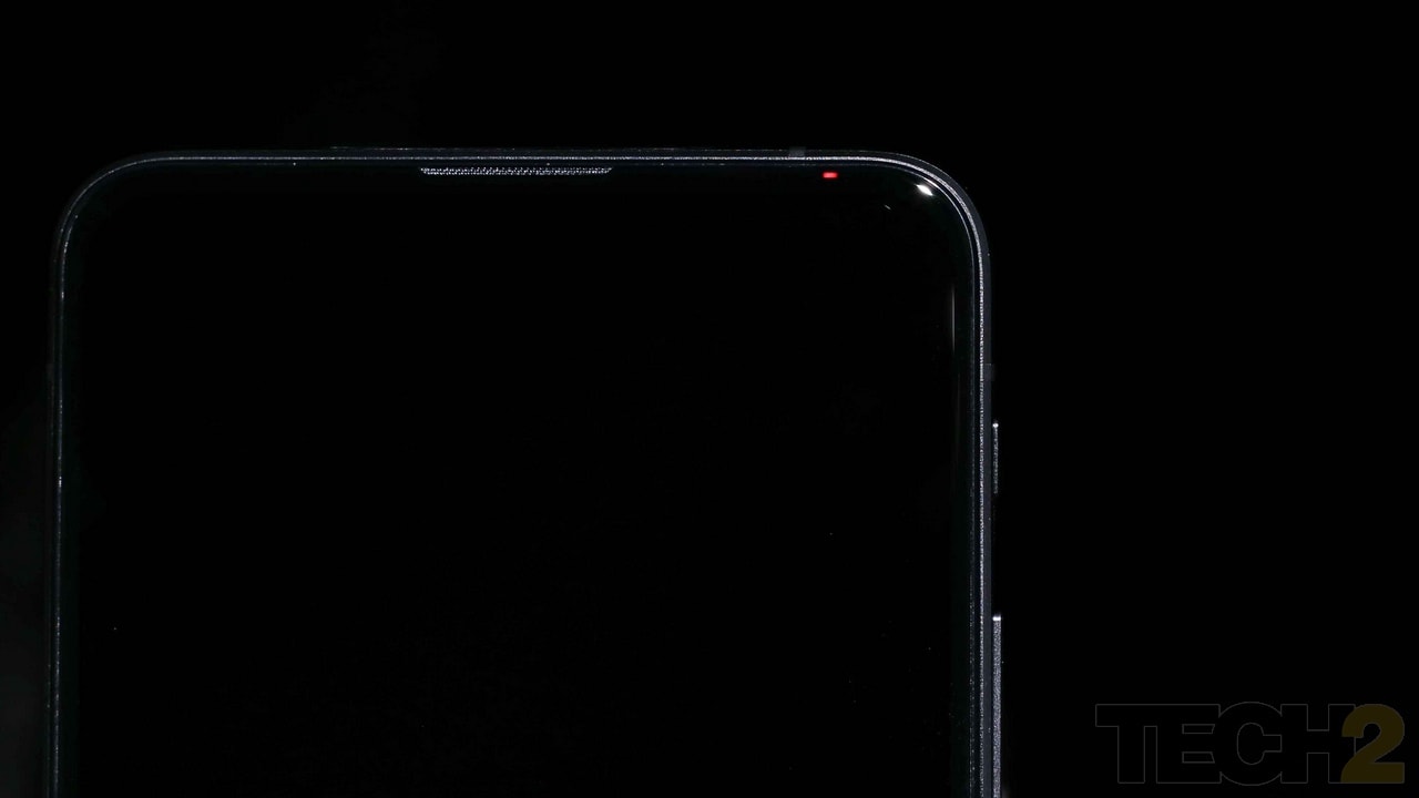 The engineers somehow managed to squeeze in the sensors and made place for an LED indicator in the top right bezel which is already razor thin. Image: Tech2/Omkar P