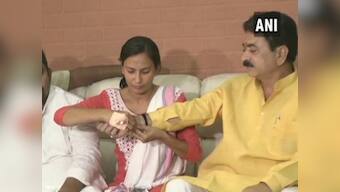 BJP MLA says woman NCP leader he kicked, punched on streets is 'like my sister'; victim ties him rakhi