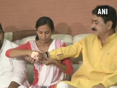 BJP MLA says woman NCP leader he kicked, punched on streets is 'like my sister'; victim ties him rakhi BJP MLA says woman NCP leader he kicked, punched on streets is 'like my sister'; victim ties him rakhi