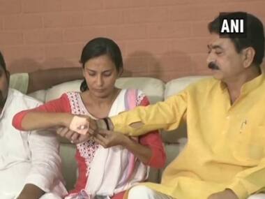 BJP MLA says woman NCP leader he kicked, punched on streets is 'like my sister'; victim ties him rakhi
