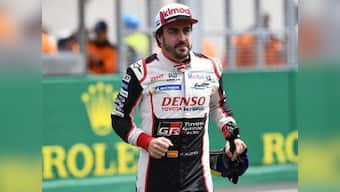 Fernando Alonso wins second straight Le Mans 24 Hour race title with Toyota after fortuitous puncture takes out race leader