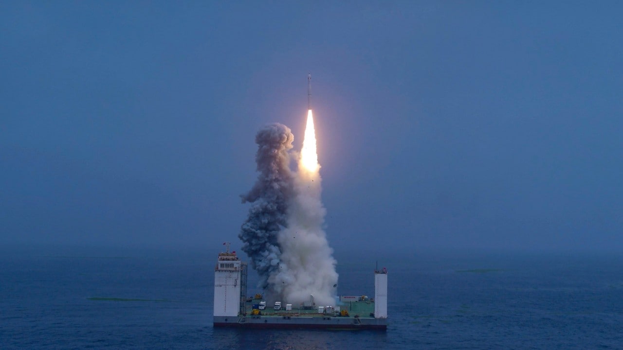 A Long March rocket takes off from a launchpad at sea in a first. AP