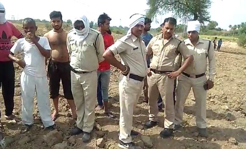 Policemen at the site of the rape, murder of a five-year-old Dalit girl in Ujjain. 101Reporters.com