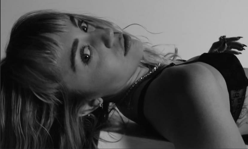 Miley Cyrus alludes to drugs, partying, marriage, and public image in new EP She Is Coming
