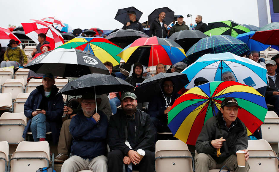 Bangladesh, Sri Lanka and local fans were all collected inside the stadium, with umbrella in one hand and coffee mugs on the other. The weather was pleasant yet it stopped the cricket action to take place. Reuters Bangladesh, Sri Lanka and local fans were all collected inside the stadium, with umbrella in one hand and coffee mugs on the other. The weather was pleasant yet it stopped the cricket action to take place. Reuters