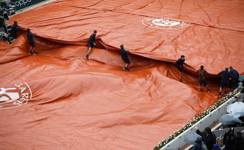 About 45 minutes later, tournament officials announced the match would resume Saturday. AP About 45 minutes later, tournament officials announced the match would resume Saturday. AP