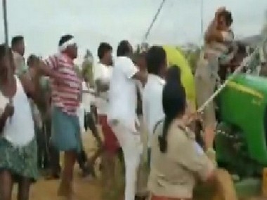 TRS leaders led by party MLA attack police, forest guards at Asifabad; legislator alleges officials were 'terrorising adivasi farmers' TRS leaders led by party MLA attack police, forest guards at Asifabad; legislator alleges officials were 'terrorising adivasi farmers'