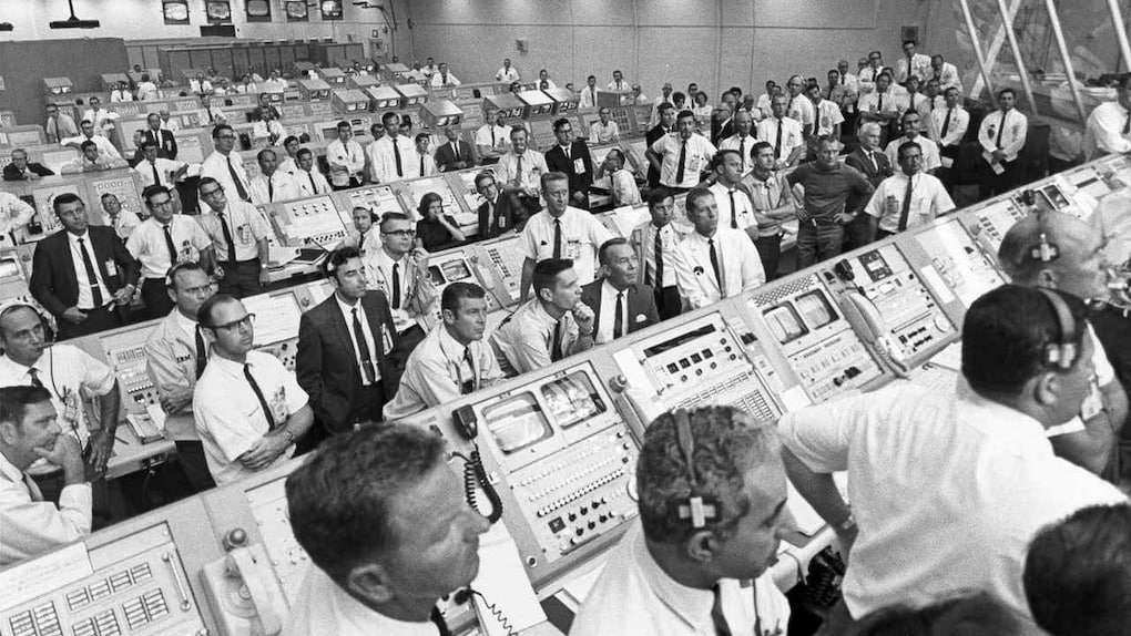 NASA's crew monitoring the launch from the control room. Source: ALSJ/NASA