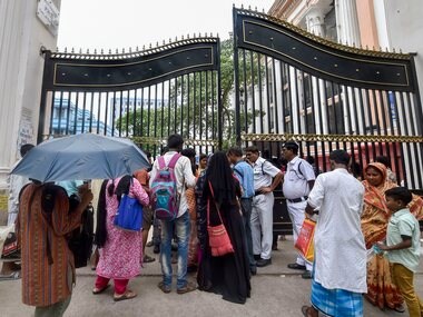 Relatives of patients stand outside the main gate of Calcutta Medical College and Hospital during the doctor's strike in Kolkata. PTI