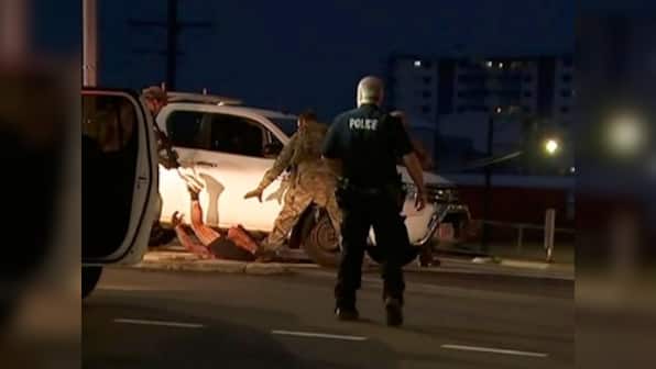 Four dead in Australia's Darwin after gunman opens fire inside motel; suspect in custody, PM calls attack 'terrible act of violence'